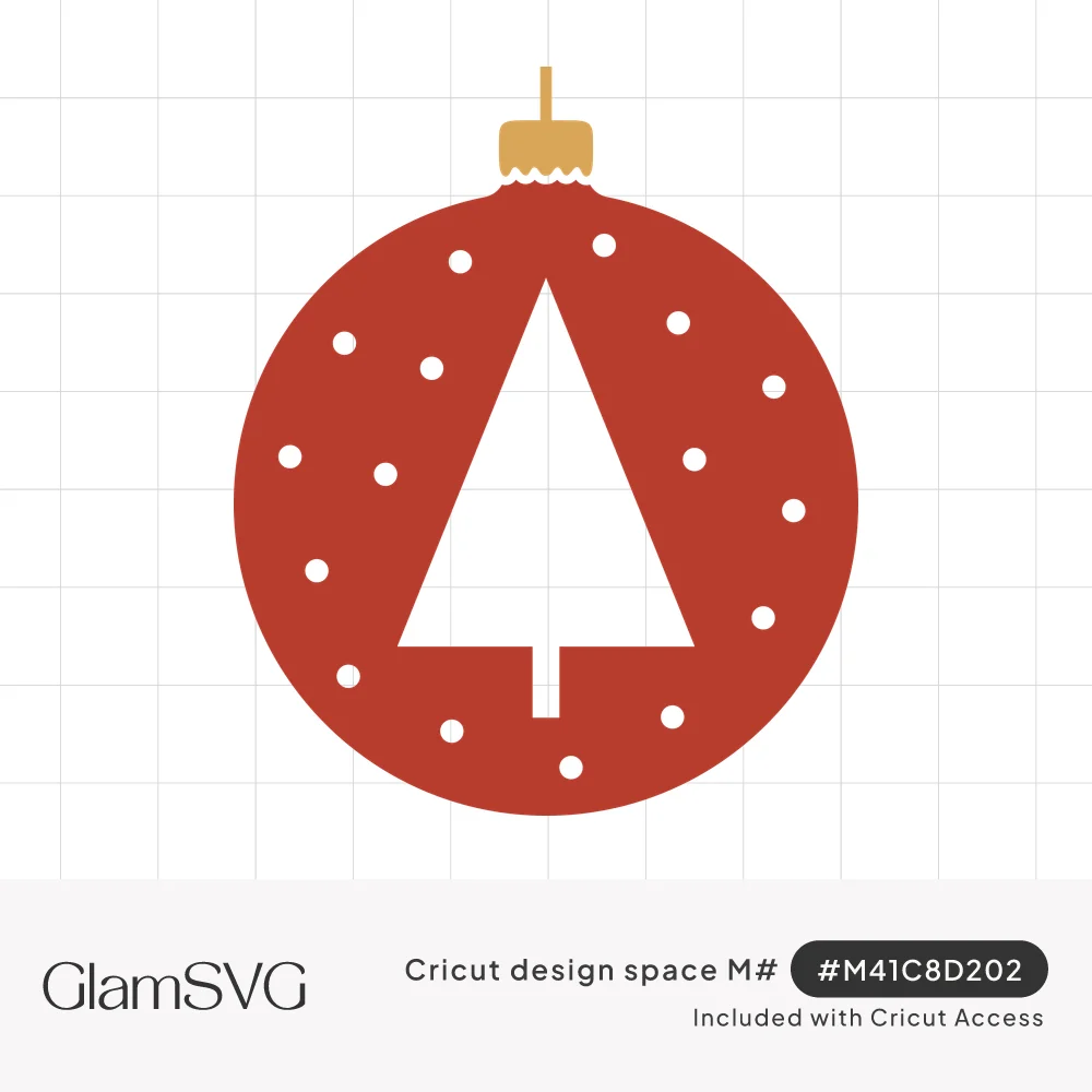 Red round Christmas ornament with a gold cap, a white triangle tree cutout and scattered white snow dots