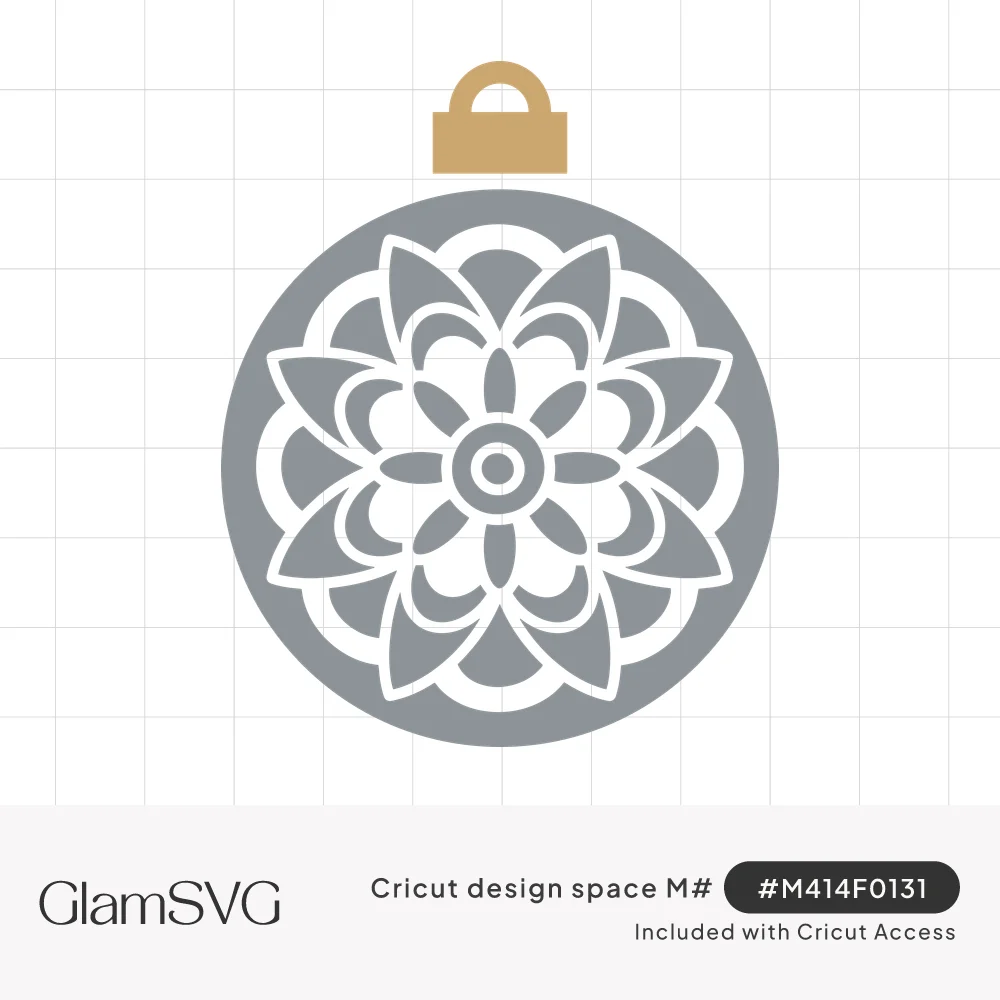 Gray round Christmas ornament with a white cut-out mandala flower pattern and a gold hanger cap on top