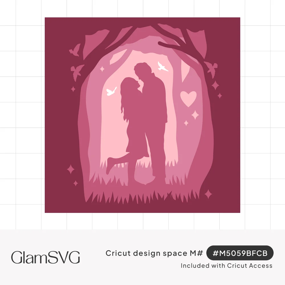 Layered pink paper-cut shadowbox of a couple kissing under arching forest trees with doves, sparkles and a heart