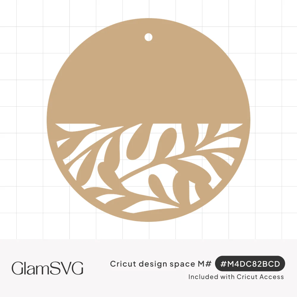 Round tan gift tag with a hole at the top and a cut-out pattern of leafy branches across the lower half