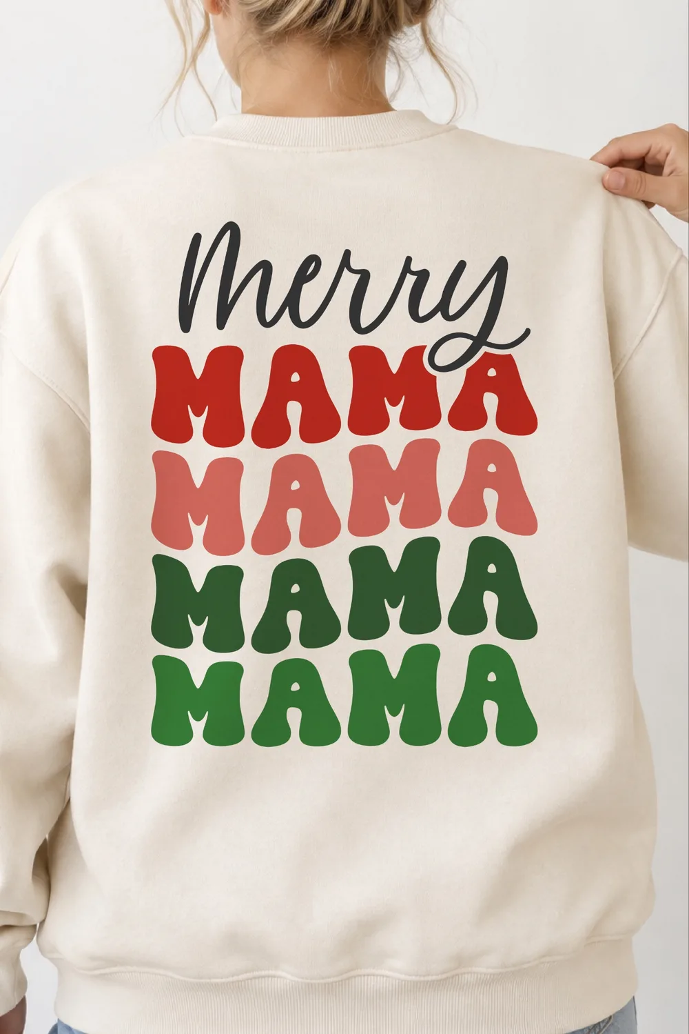 Cream crewneck sweatshirt seen from the back with black script Merry over stacked red, pink and green MAMA lettering