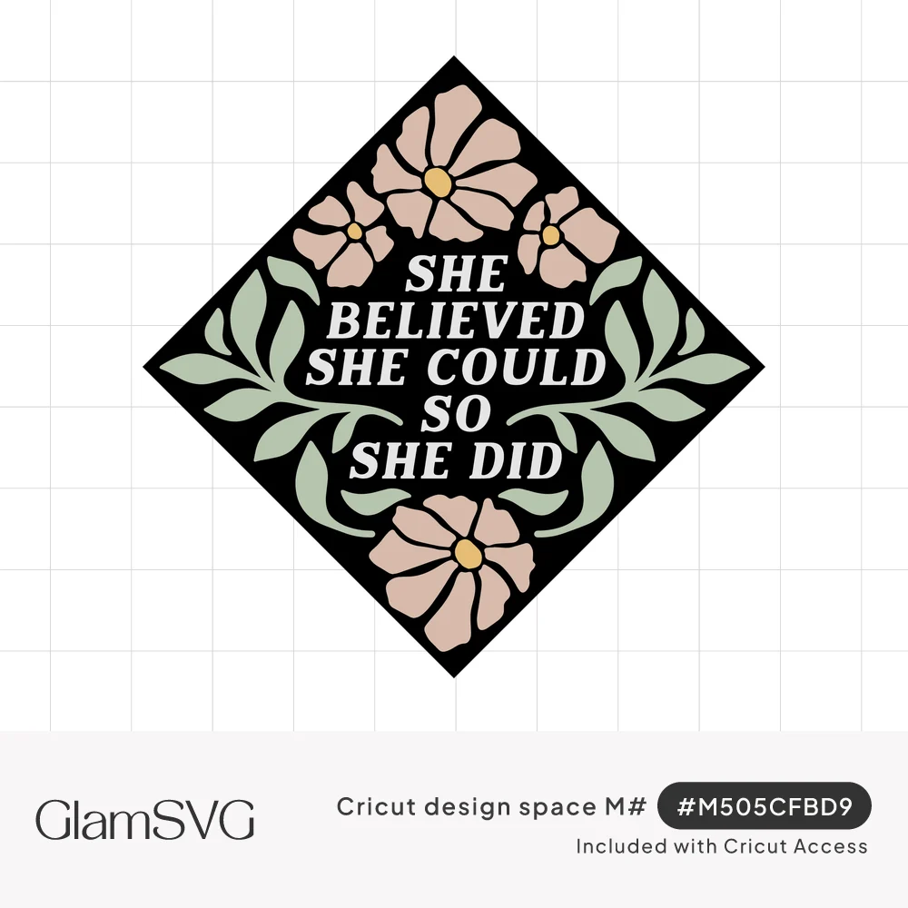 Black diamond with white text She Believed She Could So She Did, surrounded by pink flowers and sage green leaves